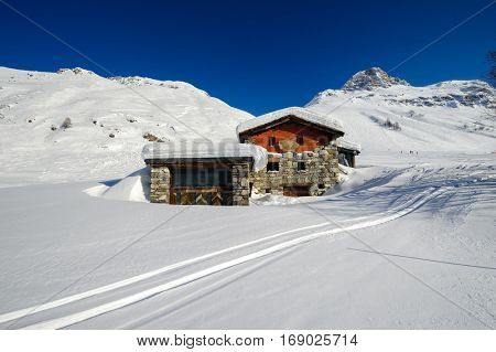 Alpine winter mountain landscape. French Alps covered with snow in sunny day. Val-d'Isere, France