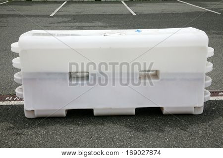 Plastic Molded Parking Control Barrier outdoor in a parking lot. Parking Control. Traffic Flow. Traffic Control.