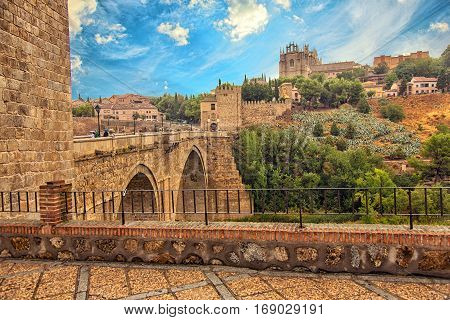 View of old historical city Toledo with Alcantara bridge. Toledo Spain