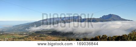 Panorama of Plain of Cafres with Snow Peak morning clouds and blue sky