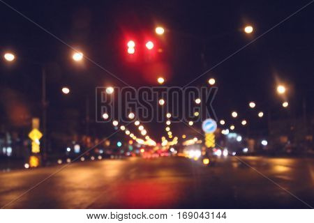 Bokeh traffic light on the road for background