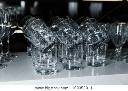 a lot of glasses of whiskey on the table