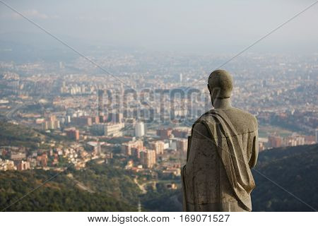 Statue on Tibidabo hill over the Barcelona city