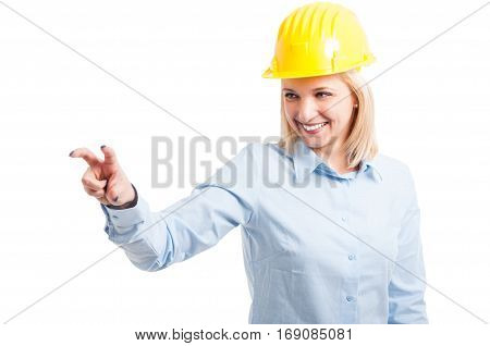 Female Engineer Wearing Helmet Using Touchscreen