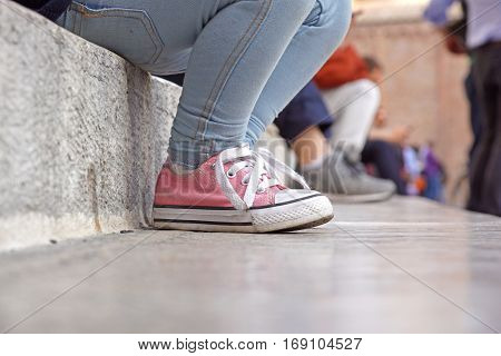 close up from baby shoes sitten on stairs .