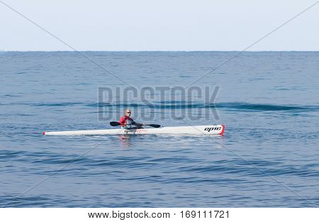 Athlete Training On Kayak Winter Morning On Sea Near Coast