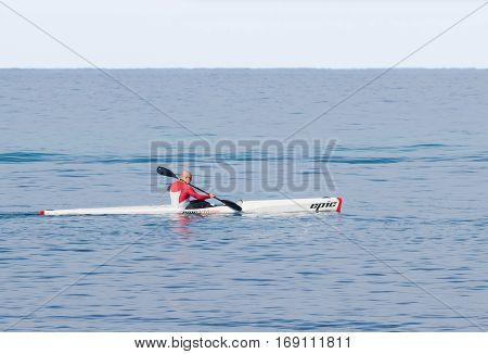 Athlete Training On Kayak Winter Morning On Sea Near Coast