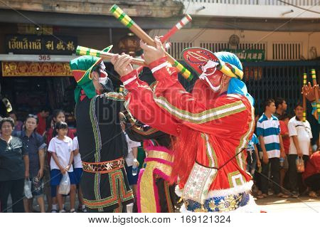 NAKHONSAWAN ,THAILAND - JANUARY 31,2017 : Unidentified fighting show of villager warriors ( Aung-Gor ) on the street in city during the Chinese New Year celebrations in Nakhonsawan Province,Middle of Thailand.
