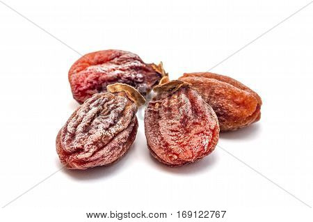 Several dried persimmon isolated on white background