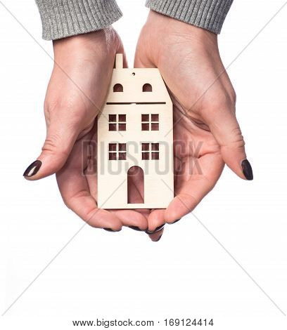Architecture building real estate and property concept . Woman holding house or home maquette.