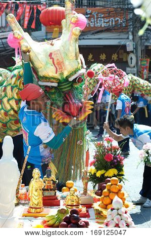 NAKHONSAWAN , THAILAND - JANUARY 31,2017 : Group Parade of Golden dragon show at Middle market in Nakhonsawan city during the Chinese New Year celebrations in Nakhonsawan Province ,Middle of Thailand.