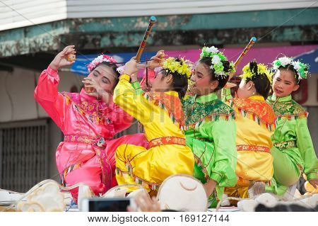 NAKORNSAWAN ,THAILAND - JANUARY 31,2017 : Unidentified young girls provide music for dance on the parade during Chinese New Year celebrations in Nakornsawan Province ,Middle of Thailand.