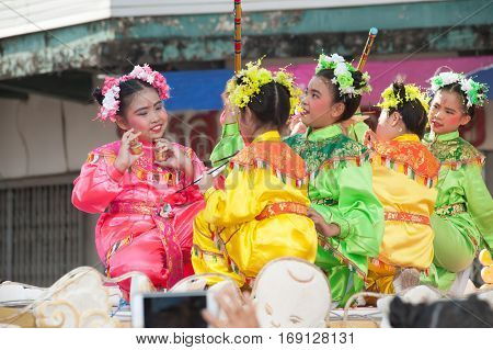 NAKORNSAWAN ,THAILAND - JANUARY 31,2017 : Unidentified young girls provide music for dance on the parade during Chinese New Year celebrations in Nakornsawan Province ,Middle of Thailand.
