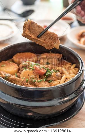 Gamjatang Korean Spicy Pork rib Soup with Kimchi and udon