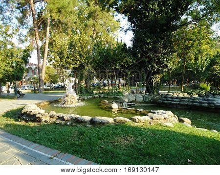 City park with lots of treas and fountains