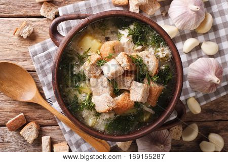 Garlic Soup With Croutons Close-up In A Bowl. Horizontal Top View