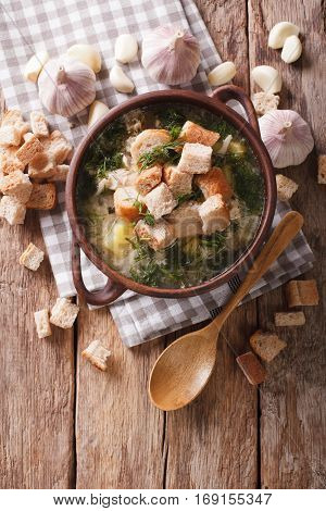 Soup With Garlic And Croutons Close-up In A Rustic Style. Vertical Top View