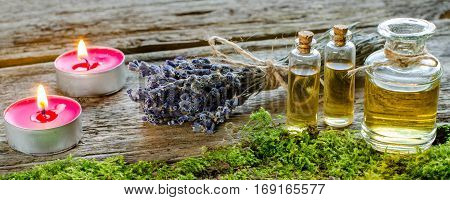 Bunch Of Dry Lavender, Candles And Bottles Of Scented Oil.