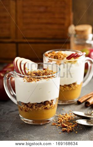 Layered yogurt and applesauce parfait with granola