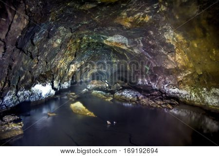 Collapsed flooded and forgotten tunnel of an abandoned coal mine