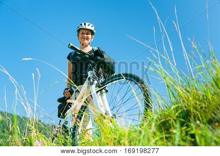 Cycling senior couple enjoying summer at the vilsalpsee in austria