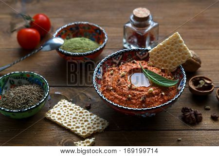 Walnuts And Pepper Dip Sauce Muhammara And Ingredients Close-up On The Table. Horizontal