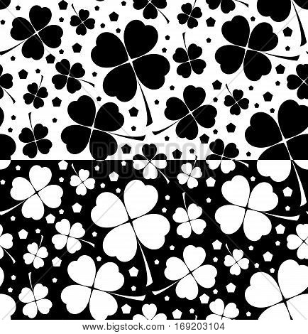 Seamless floral patterns with lucky shamrock leaves in black and white colors in two variants. Vector illustration