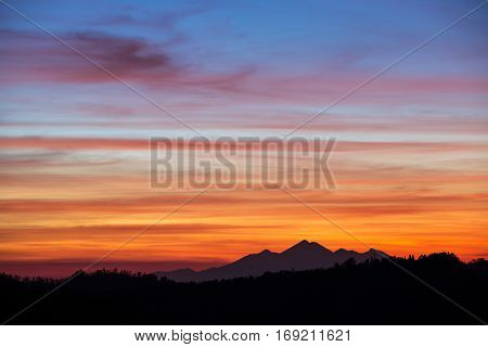 Beautiful sunset sky over the mountains in Bali, Indonesia