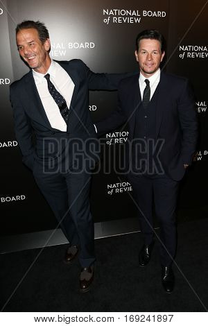 NEW YORK-JAN 4: Director Peter Berg (L) and Mark Wahlberg attend the National Board of Review Gala at Cipriani Wall Street in New York on January 4, 2017.