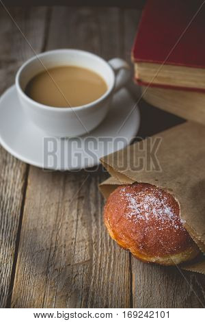 Relax time from book with Hot Coffee and Donut on wood Background used for food ad or website promote