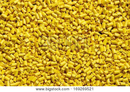 close up yellow plastic resin ( Masterbatch ) for background