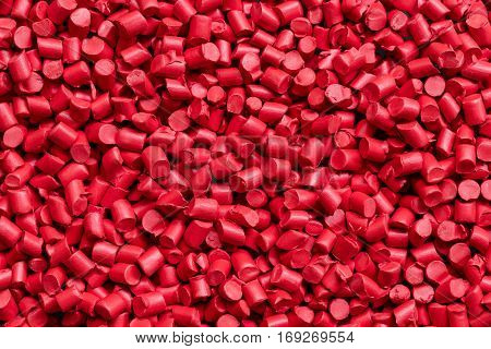 close up red plastic resin ( Masterbatch ) for background