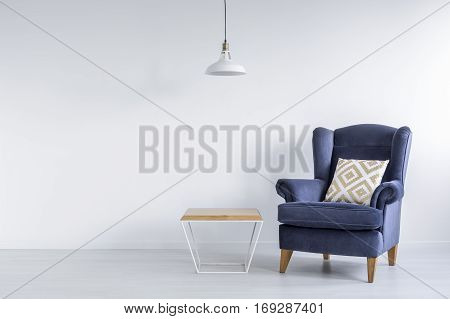 Ascetic Room With Blue Armchair