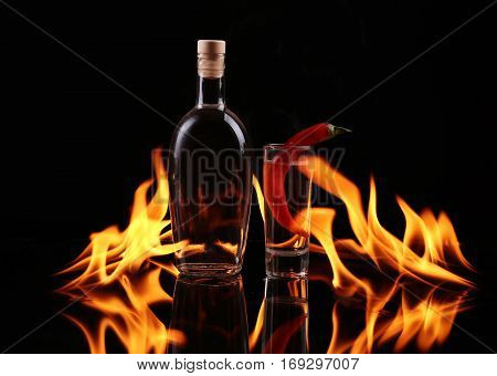 Stack of tequila  with boutle on fire