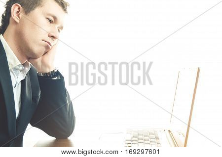 business man working at office with laptop on his desk