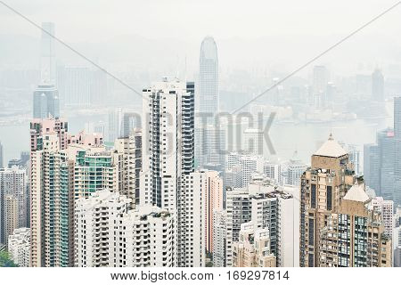 Business concept for real estate and corporate construction - panoramic modern city skyline bird eye aerial view with morning grey sky in Hong Kong (HK) China