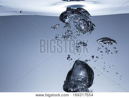 Air bubbles in water, similar to the liquid melal