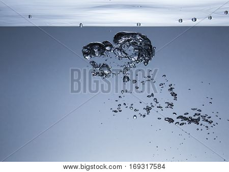 Air bubbles in water, similar to the liquid melal