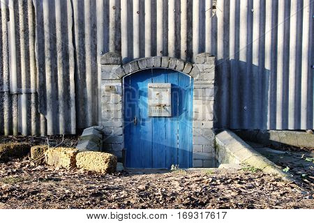 The blue gate of the old house in the village