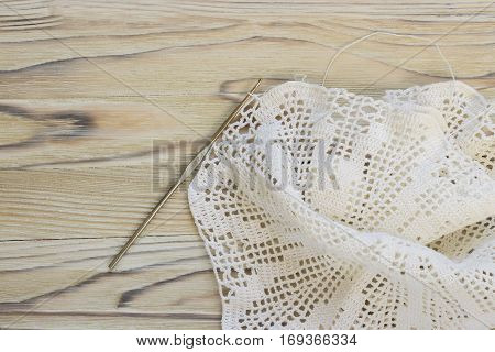The beginning of handmade crocheted cotton organic doily . Old metal crocheting hook and cotton yarn ball. Needlework creative craft Mori Girl lace style