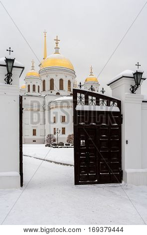 Opened gate to temple in snowy winter day. Orthodox temple. On photo - Novo-Tikhvinsky women monastery, Ekaterinburg.