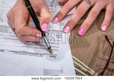 Business Lady Filling Tax Form. 2017. Financial Concept.