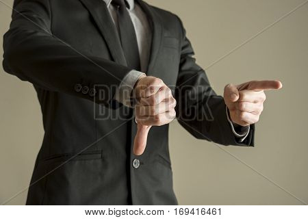 Businessman Giving A Thumbs Down Negative Vote