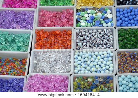 Multi colored beads and tools for making jewelry and crafts