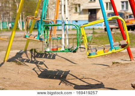 Empty Playground and swings in colorful park Russia.