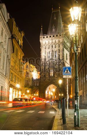 Night View Of The Powder Tower Or Powder Gate. This Landmark Is A Gothic Tower In Prague, Czech Repu