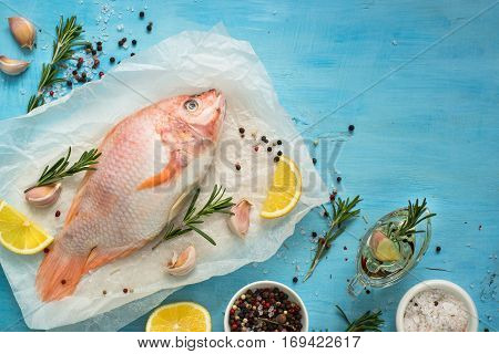 Fresh raw fish tilapia. Nile tiapia Oreochromis niloticus. Top view. Food cooking background.