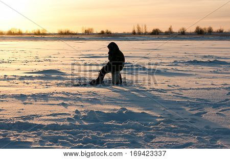 Fisherman enjoying a days fishing on the ice