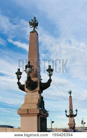 The obelisk at the entrance to the Trinity Bridge. Saint Petersburg Russia.