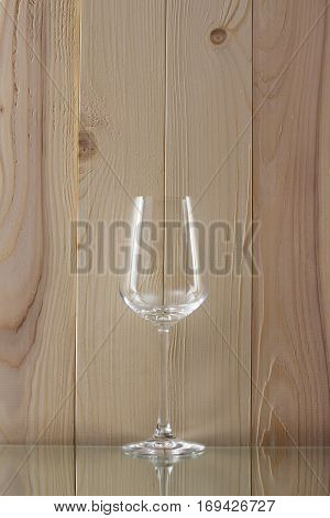 transparent glass standing on a glass stand with a wooden background